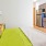 Studio bedroom space across from the kitchen