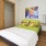 Bedroom with a large closet and neutral wall paint